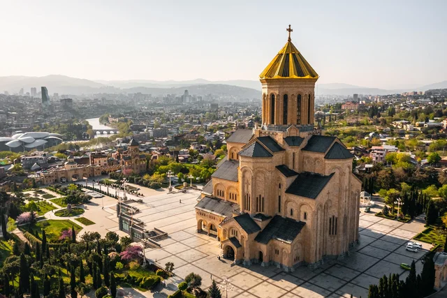 Golden-domed cathedral overlooking city skyline