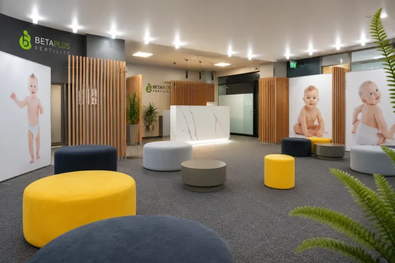 Modern reception area of a fertility clinic with colorful ottomans.